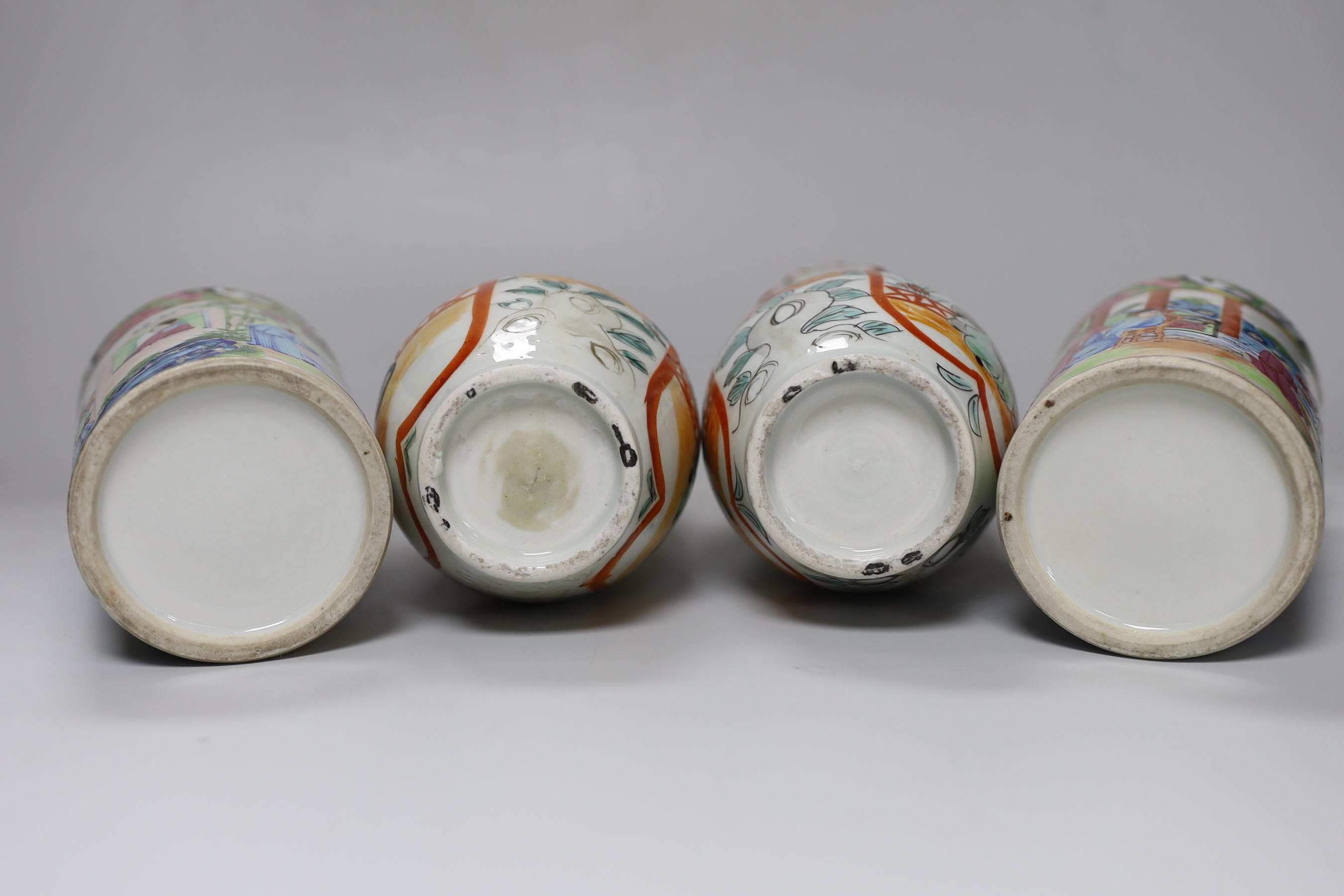 A pair of 19th century Cantonese famille rose porcelain brushpots, decorated with figural scenes, together with a further pair of Japanese export vases (4)